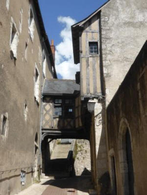 Interesting street in Blois with little bridge house