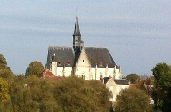 Saint John the Baptist church in Montresor from field below village