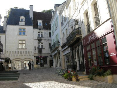 cobbled street in Loches showings some of the shops