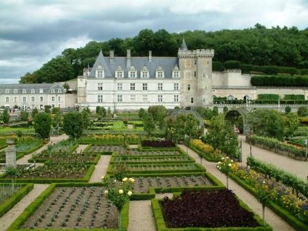 Looking over the kitchen gardens at Chateau Villandry in Centre-Val de Loire  towards the chateau itself